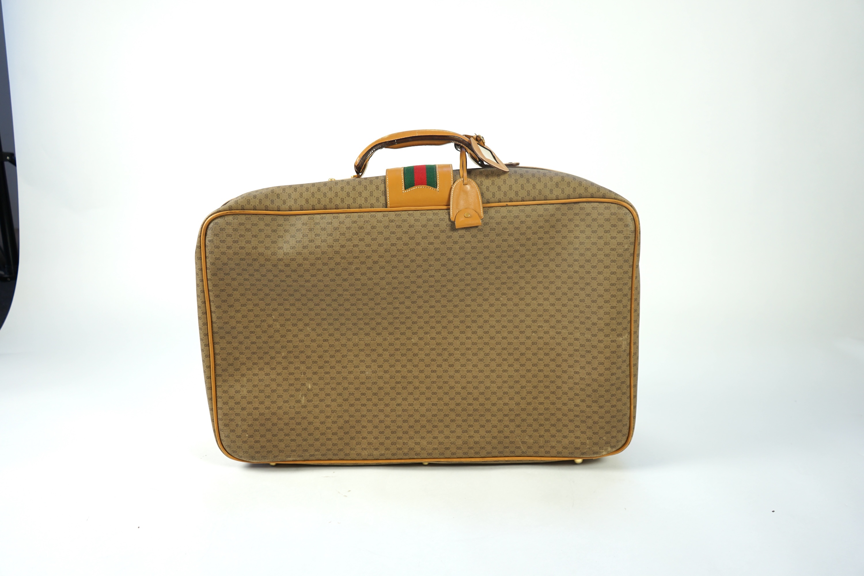 A vintage Gucci micro GG monogram canvas suitcase